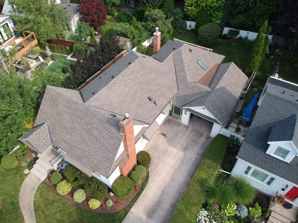 Two-storey St. Catharines home with a new light grey architectural shingle roof, aerial view