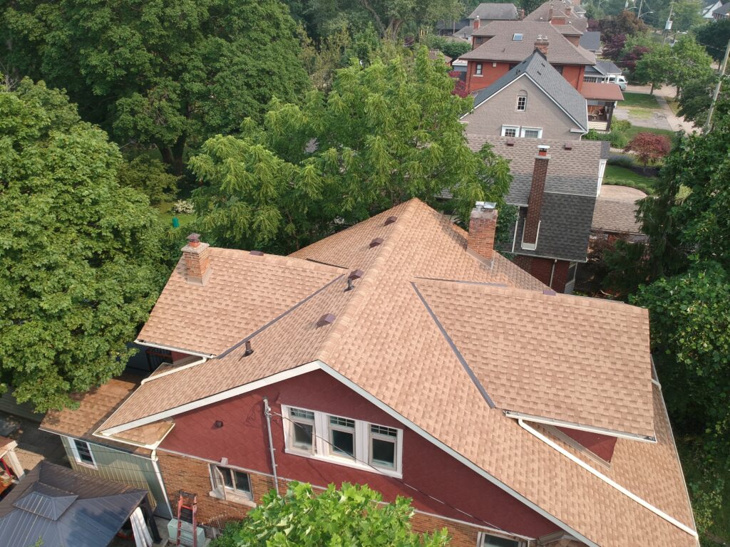 St. Catharines home with a new tan shingle roof, aerial view