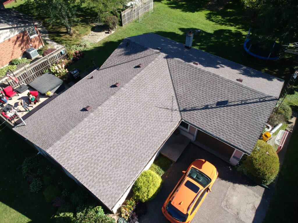 Vineland-area home with a new grey shingle roof, aerial view