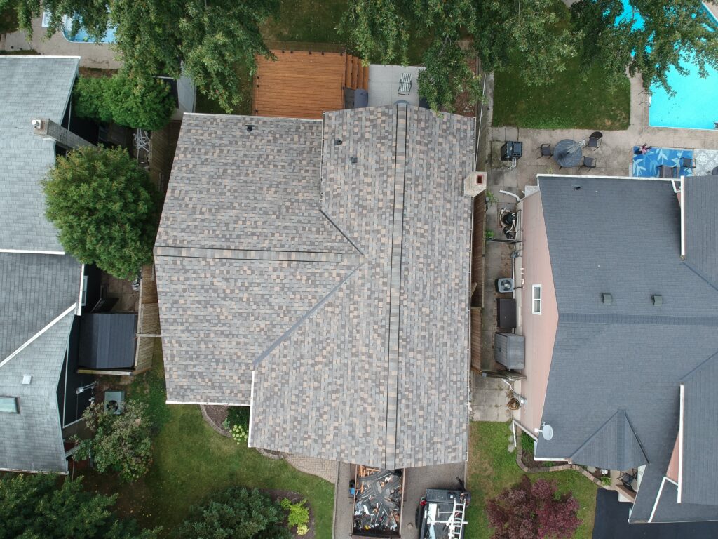 St. Catharines home with a new light grey shingle roof, top-down aerial view
